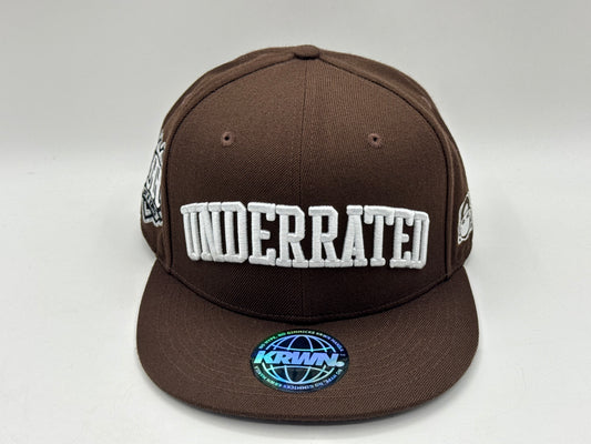 “Underrated” Snapback Cap – Brown by KRWN
