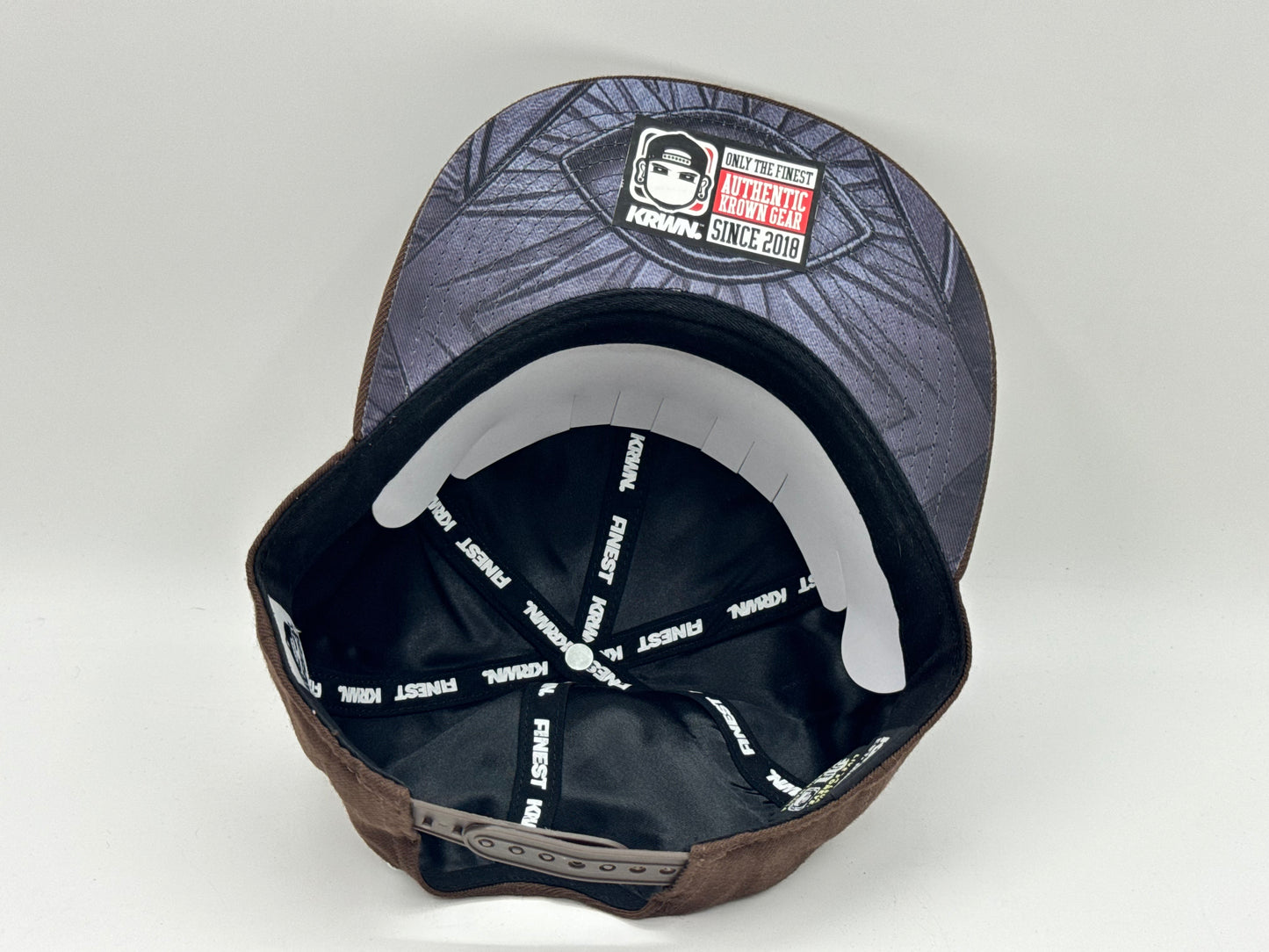 “Underrated” Snapback Cap – Brown by KRWN