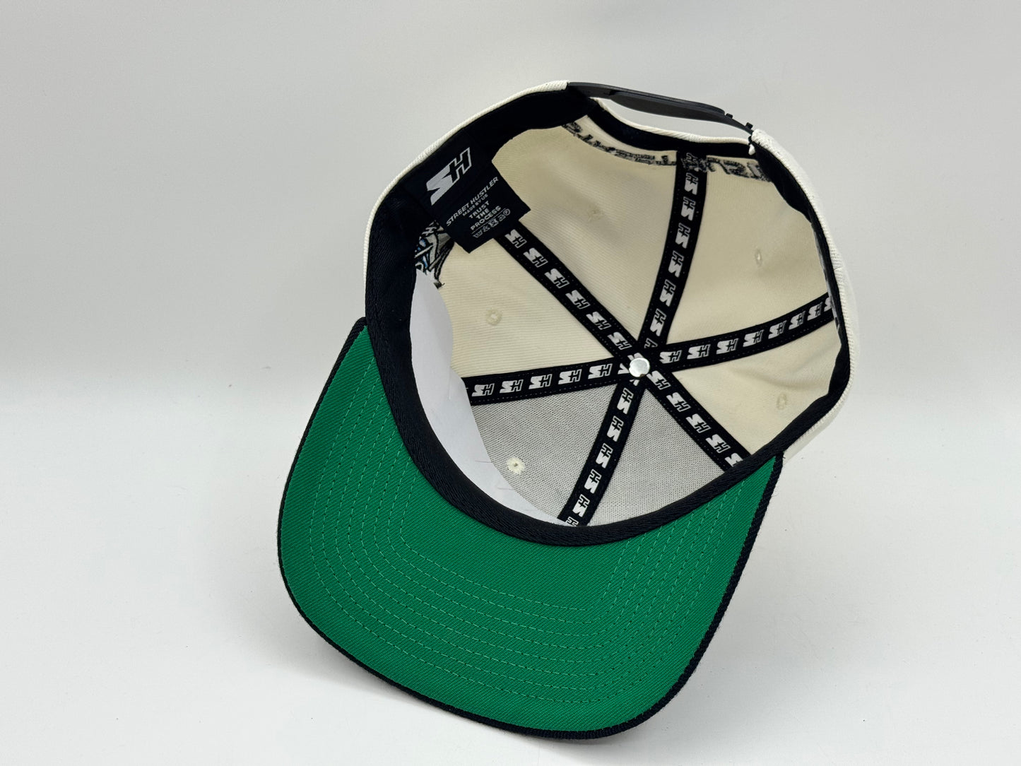 “SH” Single Stooth Snapback – Cream/Black by Street Hustler