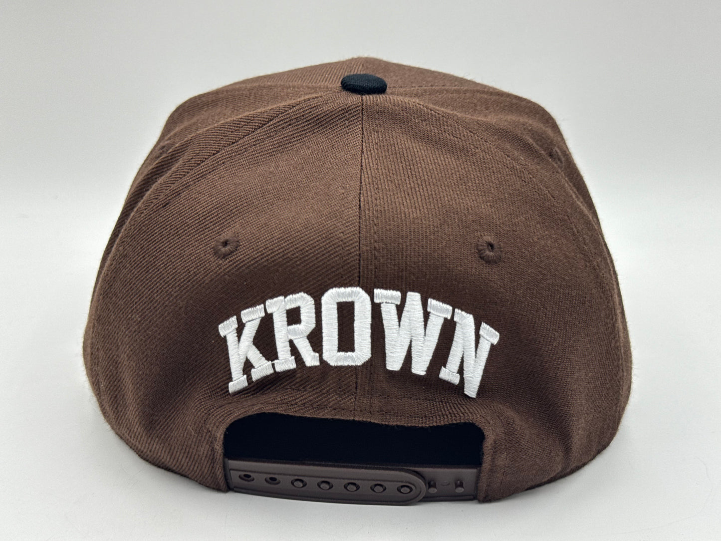 “Underrated” Snapback Cap – Brown / Black by KRWN