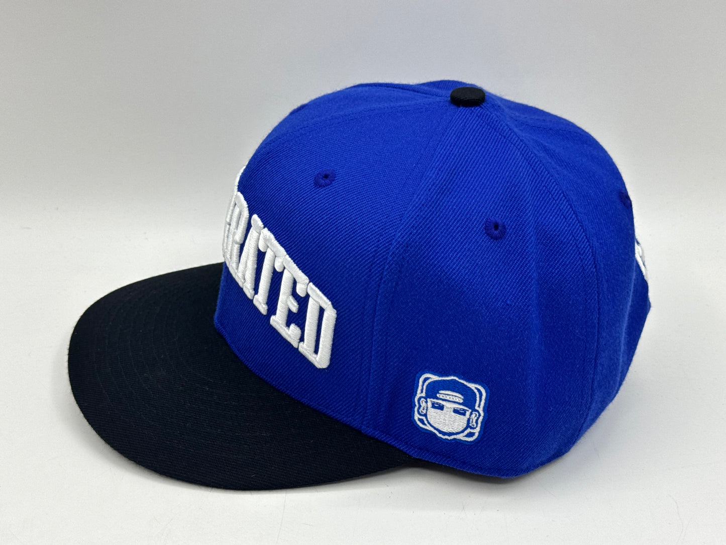 “Underrated” Snapback Cap – Royal Blue / Black by KRWN